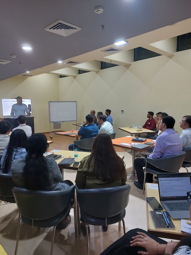A Damco team working through a session in a meeting room